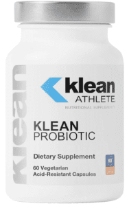 An image displaying a bottle of Klean Probiotic capsules, a dietary supplement. The bottle is white with blue and labeling, indicative of the brand's clean, professional aesthetic.