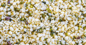 A close-up view of hemp hearts, revealing their small, ivory-colored seeds with a delicate, nutty texture.